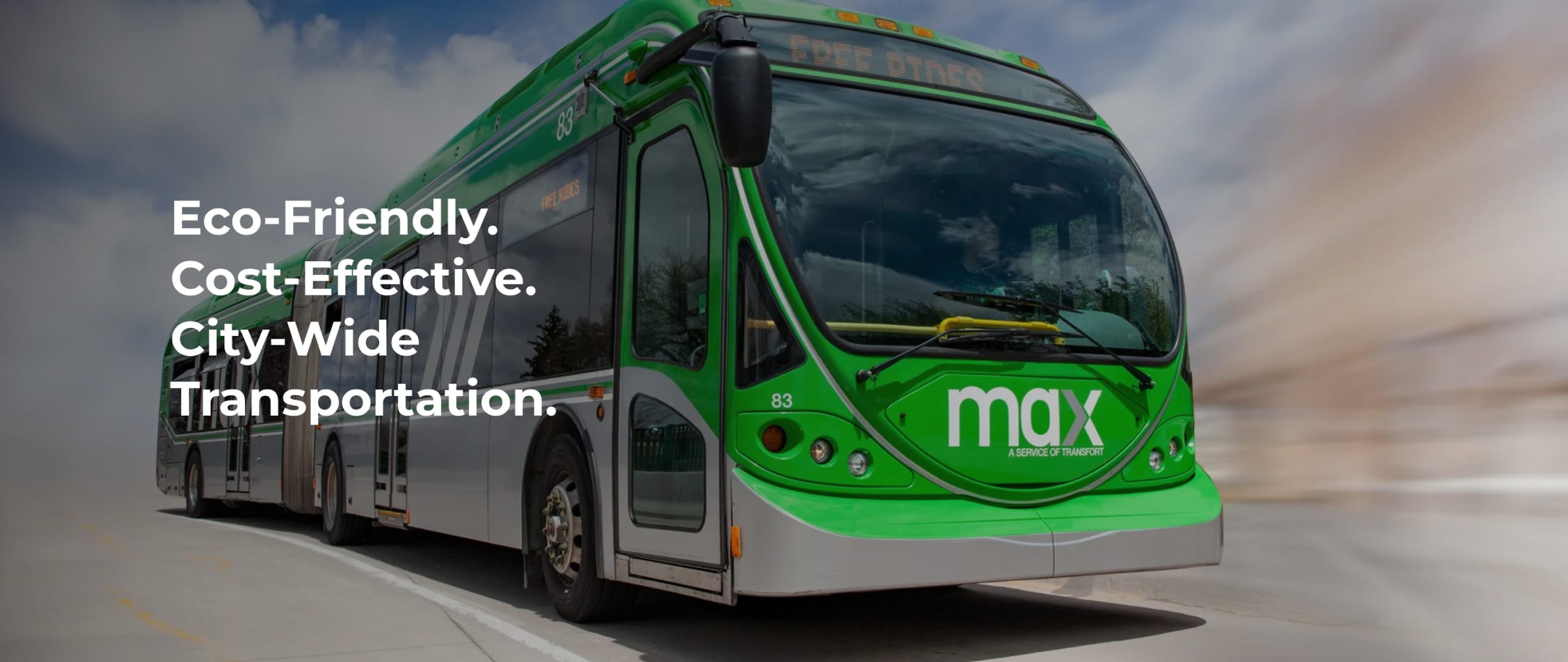 Front view of Transfort Max bus with overlay text that says, "Eco-friendly. Cost-effective. City-wide transportation."